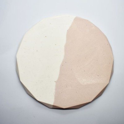 Round, faceted ceramic plate divided diagonally into white left half and pale pink right half. - Bling On Decor® | Luxury Handmade Home Decor ANJU BALA