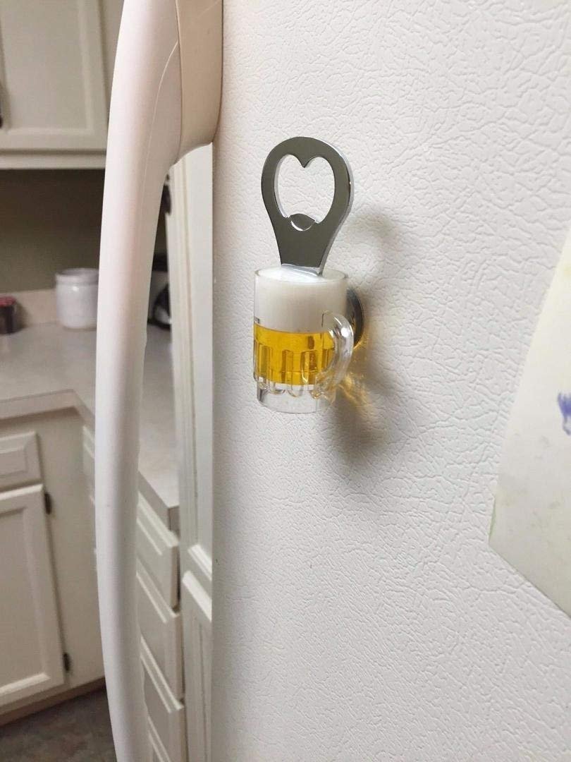 61YnsAA9AdL._SL1080_.jpg - Bling On Decor® | Luxury Handmade Home Decor Wall-mounted bottle opener with a heart-shaped opening, next to a small glass mug of beer on a white textured wall. - Bling On Decor® | Luxury Handmade Home Decor ANJU BALA