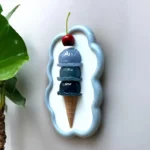 BLING-ON-Blue-Ice-Cream-Cone-3D-Wall-Art-Sculpture-Luxe-Pop-Art-Decor-Bling-On-1.webp - Bling On Decor® | Luxury Handmade Home Decor Decorative wall plaque: a four-scoop blue ice cream cone with a cherry, set in a pale blue scalloped frame. - Bling On Decor® | Luxury Handmade Home Decor ANJU BALA