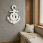 Nautical wall decor: a white anchor with a life preserver hangs on a gray wall above a beige window-seat. - Bling On Decor® | Luxury Handmade Home Decor ANJU BALA