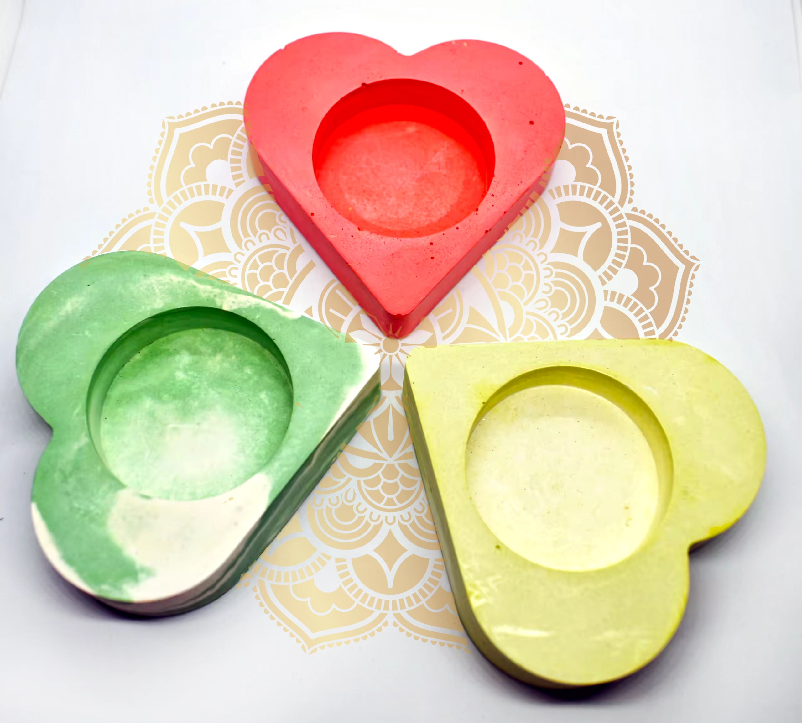 Bling-On-Tealight-Candle-Holder-I-set-of-3-Valentines-Day-Gift-Minimalistic-Home-decor-Handmade-Gifts-8-1.webp - Bling On Decor® | Luxury Handmade Home Decor Red heart-shaped object with layered cutouts centered on a decorative beige and white patterned background, surrounded by green and yellow hearts. - Bling On Decor® | Luxury Handmade Home Decor ANJU BALA