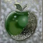 Close-up of a glossy green Christmas ornament with a jagged mosaic cap at the bottom against a blurred background. - Bling On Decor® | Luxury Handmade Home Decor ANJU BALA