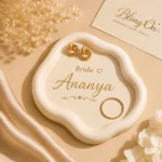 Gold bridal jewelry: two interlocked hoop earrings and a beaded ring on a white decorative plate with 'Bride Ananya' inscription. - Bling On Decor® | Luxury Handmade Home Decor ANJU BALA