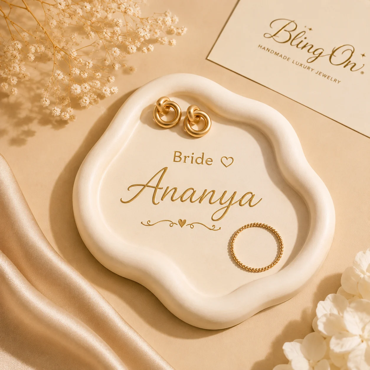Gold bridal jewelry: two interlocked hoop earrings and a beaded ring on a white decorative plate with 'Bride Ananya' inscription. - Bling On Decor® | Luxury Handmade Home Decor ANJU BALA