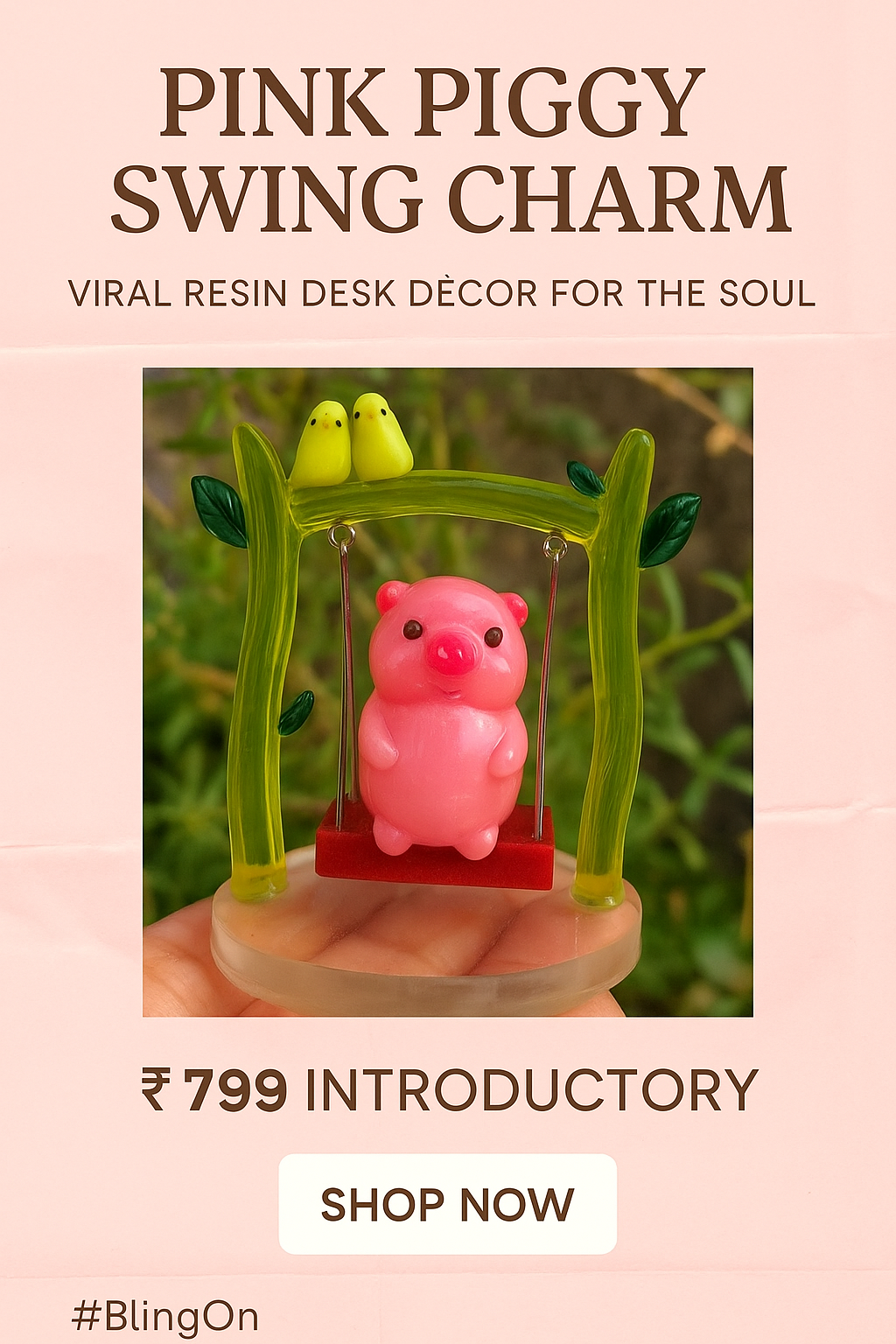 Pink piggy swing charm on a bright green frame, displayed on a pink ad packaging with price ₹799 and a 'Shop Now' button. - Bling On Decor® | Luxury Handmade Home Decor ANJU BALA