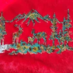 Teal and gold foil cutouts scattered on a bright red fabric background. - Bling On Decor® | Luxury Handmade Home Decor ANJU BALA