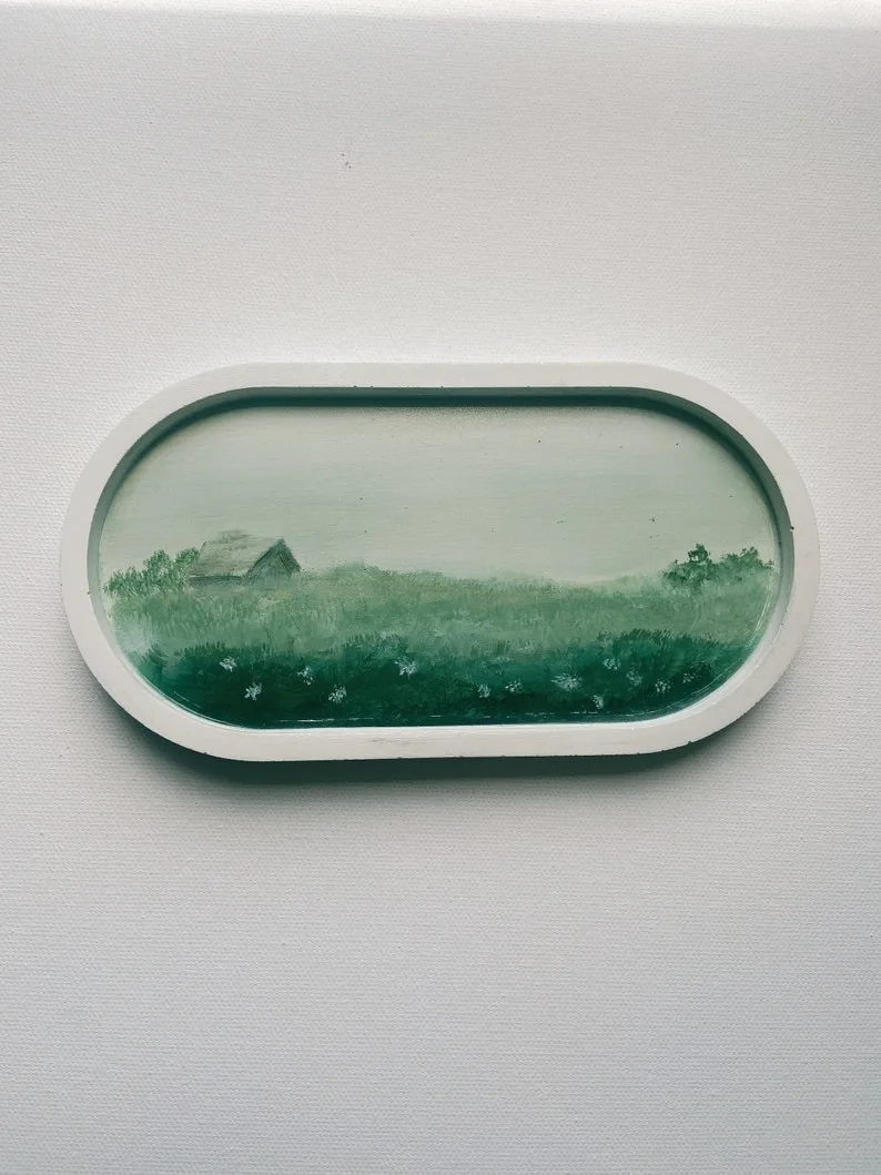 Oval framed pastoral landscape: green fields, a small house in the distance, decorative wall plaque - Bling On Decor® | Luxury Handmade Home Decor ANJU BALA