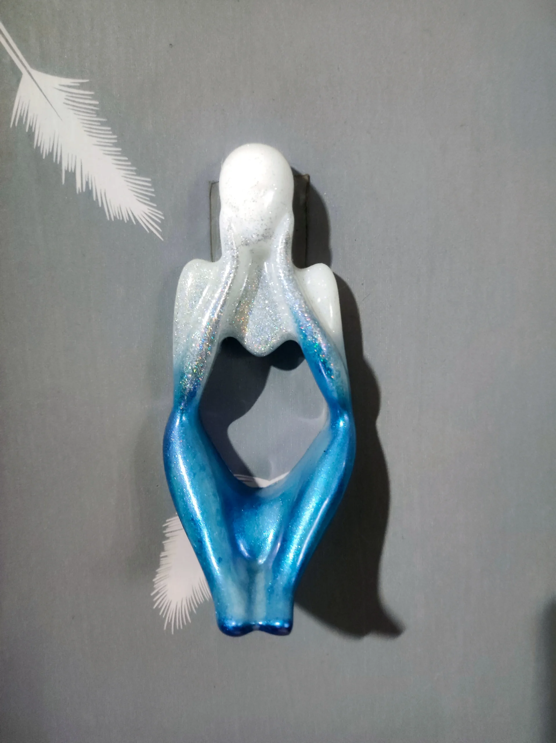 Glittery blue and white angel figurine hanging against a gray background. - Bling On Decor® | Luxury Handmade Home Decor ANJU BALA