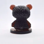 Back view of a glossy black bear bust with orange-red ears on a circular pedestal. - Bling On Decor® | Luxury Handmade Home Decor ANJU BALA