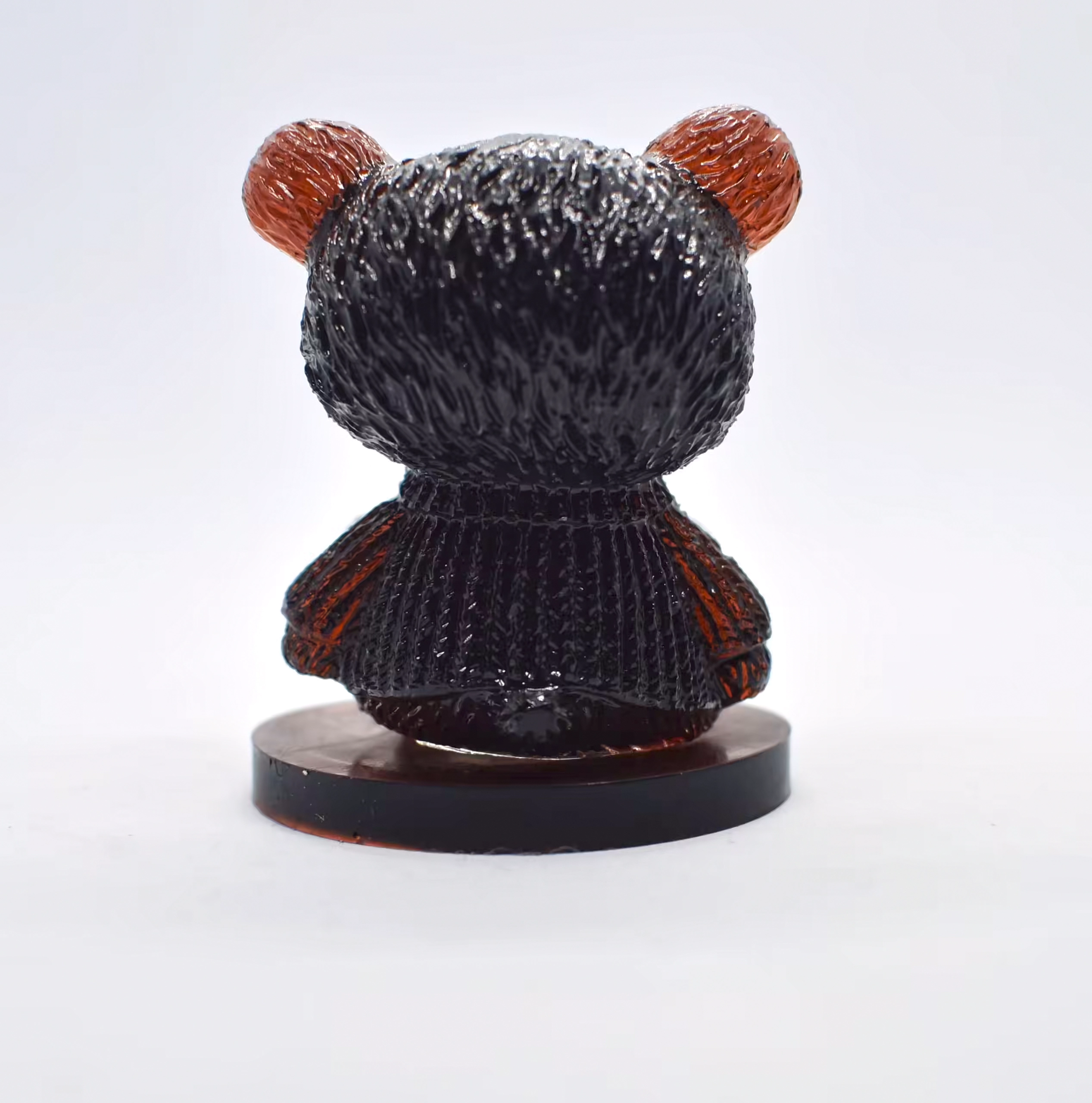 Back view of a glossy black bear bust with orange-red ears on a circular pedestal. - Bling On Decor® | Luxury Handmade Home Decor ANJU BALA