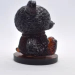 Glossy black rooster statue photographed from below on a round pedestal backdrop lightened behind it. - Bling On Decor® | Luxury Handmade Home Decor ANJU BALA