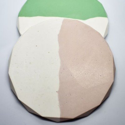 Two round handmade soaps with white and beige halves stacked, green soap behind them. - Bling On Decor® | Luxury Handmade Home Decor ANJU BALA