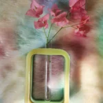 Pink bougainvillea stems in a clear glass vase, set against a pastel tie-dye background and a yellow-green decorative frame. - Bling On Decor® | Luxury Handmade Home Decor ANJU BALA