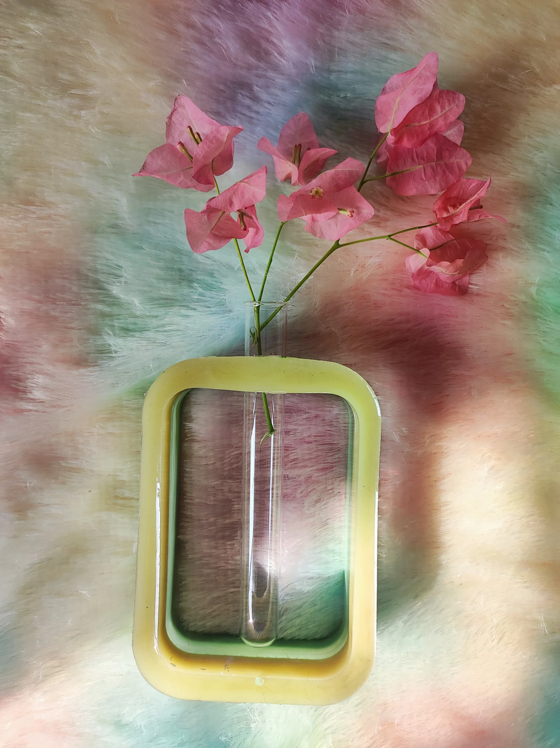 Pink bougainvillea stems in a clear glass vase, set against a pastel tie-dye background and a yellow-green decorative frame. - Bling On Decor® | Luxury Handmade Home Decor ANJU BALA